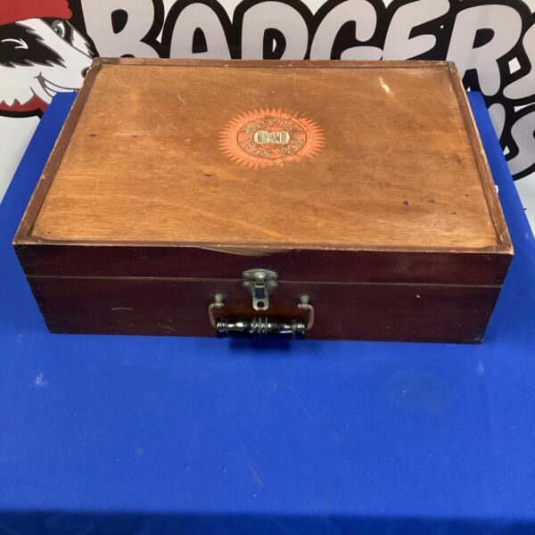 Vintage Red Seal Duplicator with wooden case and metal clasp.