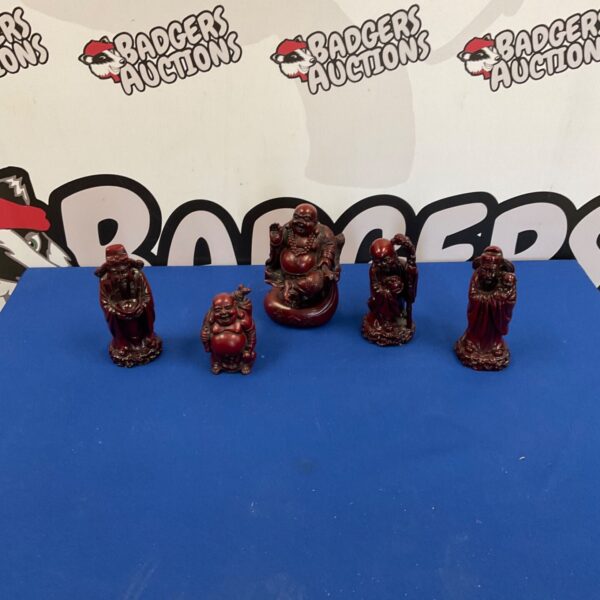 Collection of reddish-brown resin Buddha figurines for home decor.