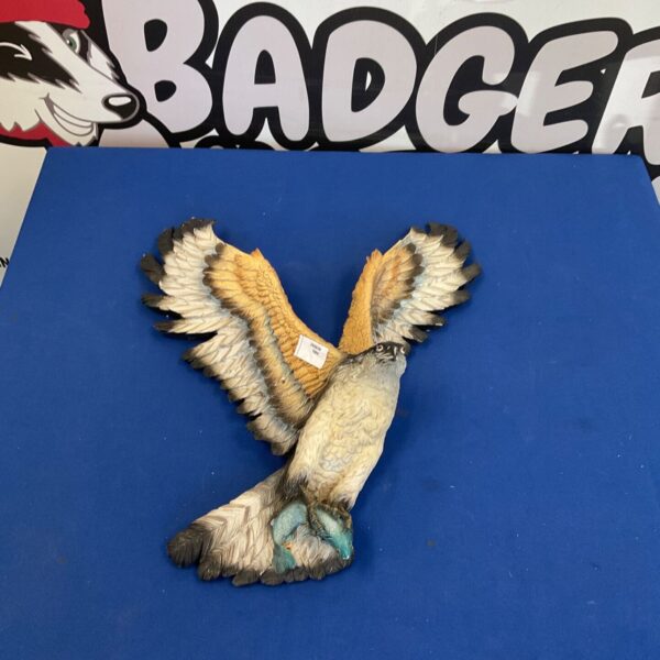 Detailed resin falcon bust sculpture for wildlife decor.