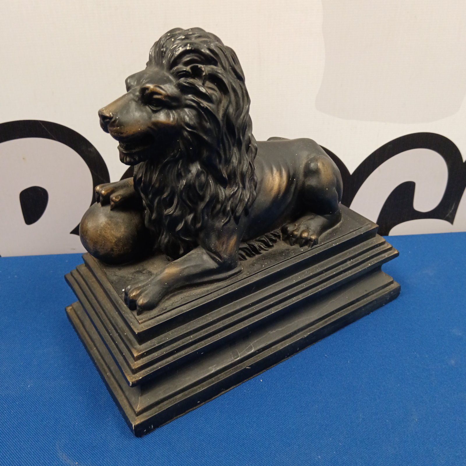 Detailed resin lion doorstop with textured fur and a sturdy base.