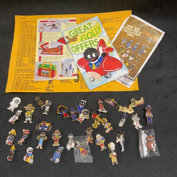 Large collection of vintage Robertson Golly enamel badges for collectors.