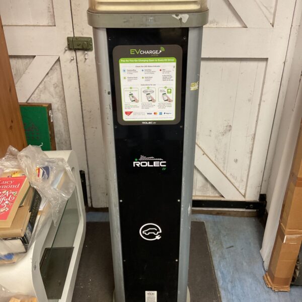 Front view of a Rolec EV car charger in a garage setting.