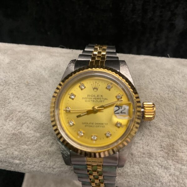 Vintage Rolex Oyster Perpetual ladies watch with gold and steel bracelet.