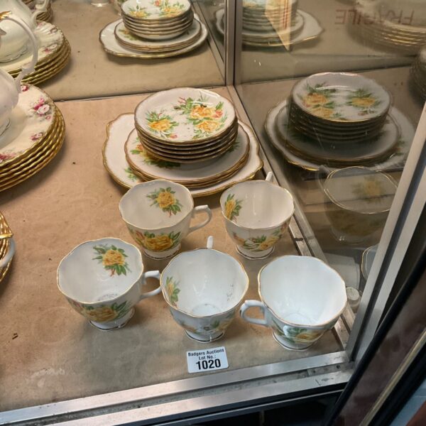 Vintage Royal Albert tea set with floral design on display.