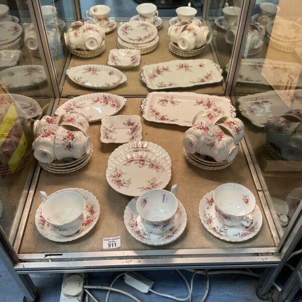 Vintage Royal Albert tea set with floral design on display.