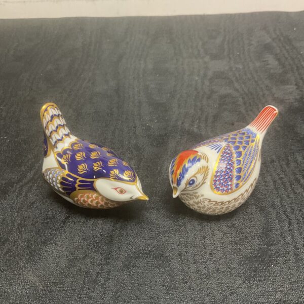 Pair of vintage Royal Crown Derby porcelain birds with Imari pattern.