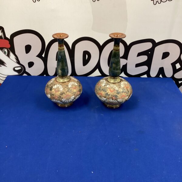 Pair of Royal Dalton Art Deco Slater vases on blue background.
