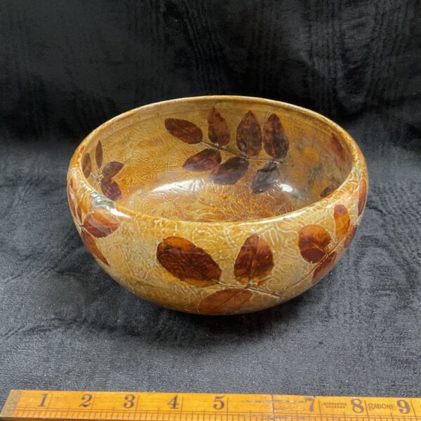 Antique Royal Doulton stoneware bowl with autumn leaves design.