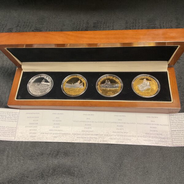 Royal Navy coin set displayed in wooden case with certificate.