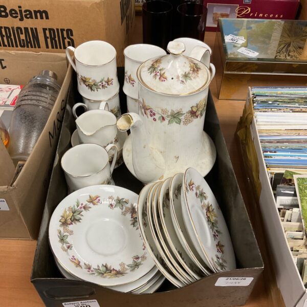 Vintage Royal Standard coffee set with floral pattern on display.