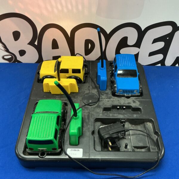 Rugged Racers RC cars and charging station vintage toy set.