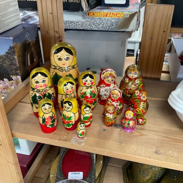 Colorful Russian dolls with floral patterns, a traditional nesting doll set.