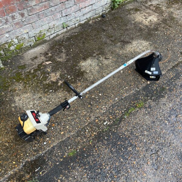 Ryobi petrol brushcutter for garden and landscaping use.