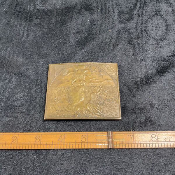 Antique brass Salem Witch belt buckle with detailed relief design.