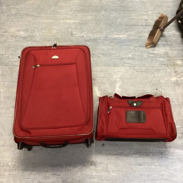 Red Samsonite suitcase on wheels, travel luggage.