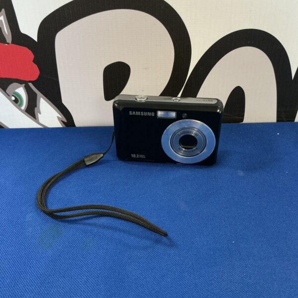 Silver Samsung ES15 digital camera, vintage point and shoot.