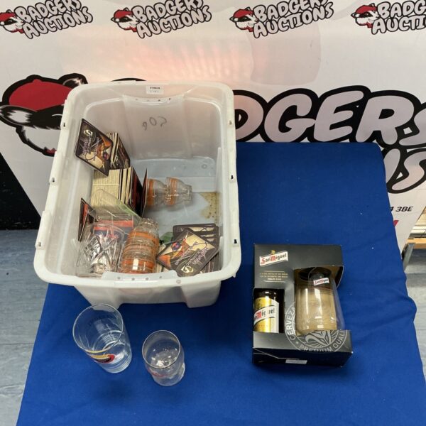 San Miguel and Rebellion glassware collection with coasters.