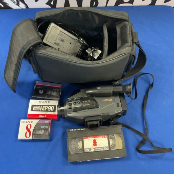 Vintage Sanyo VM-D9P VHS camcorder with tapes for retro video recording.