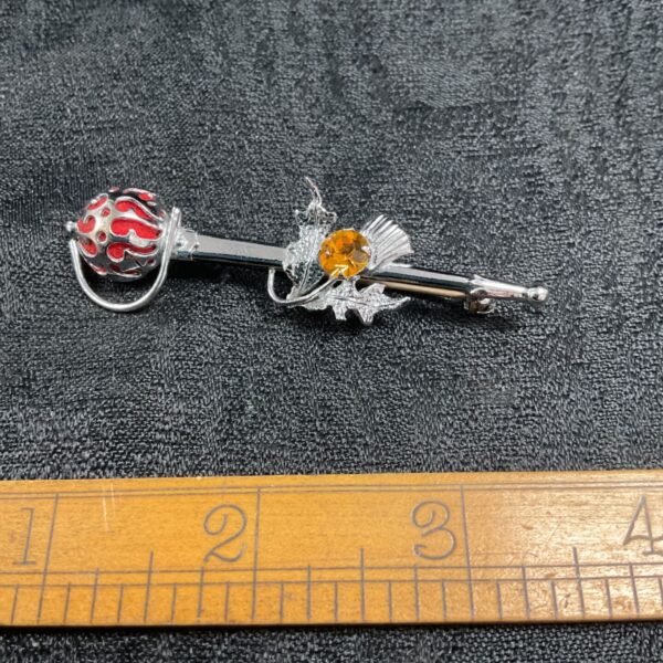Vintage Scottish kilt pin with citrine thistle and red cabochon.