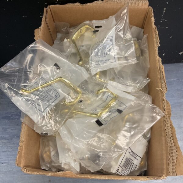 Sealed lot of vintage brass coat hooks in original packaging.