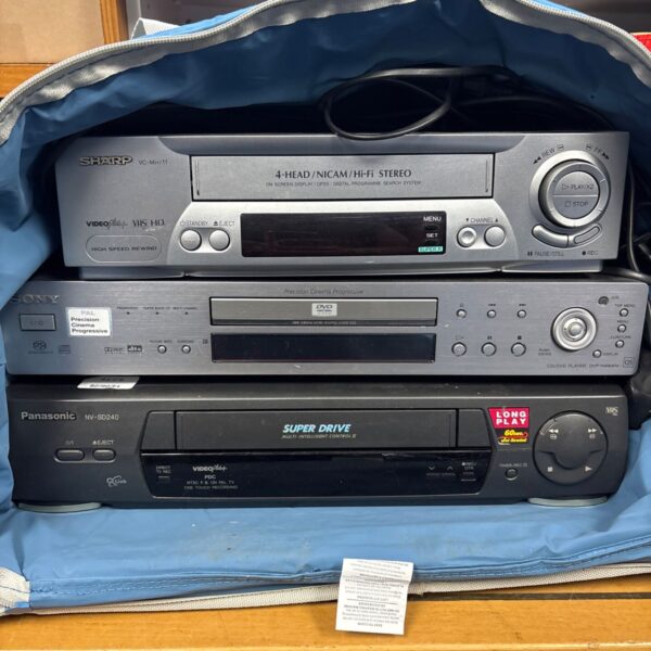 Vintage Sharp VHS player with Sony DVD and Panasonic CD player.
