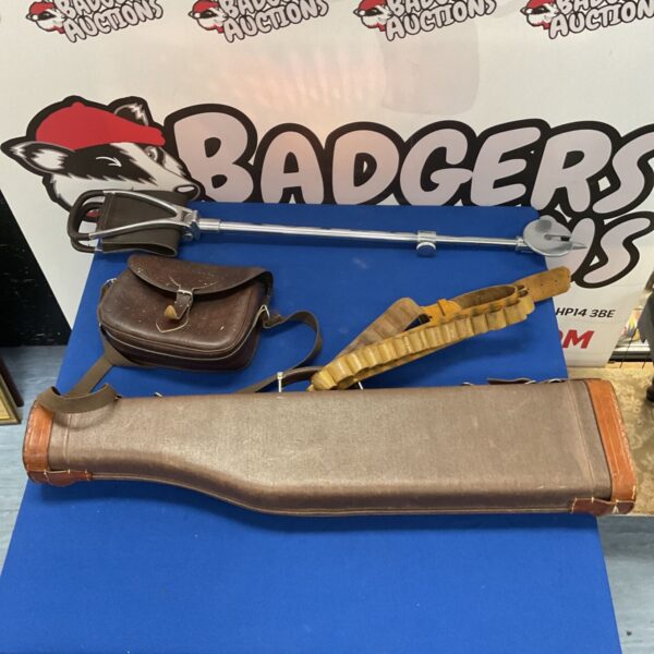 Antique shoulder of mutton gun case with shooting stick and cartridge bag.