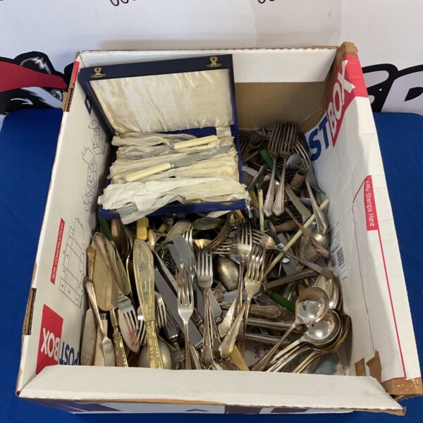Large lot of mixed silver plate cutlery in a cardboard box.