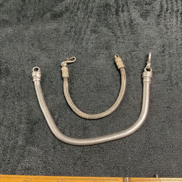 Vintage silver snake link bracelets with spring ring clasps.