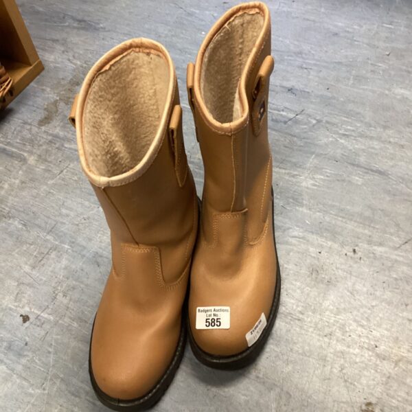 Pair of worn size 8 leather safety boots for industrial work.