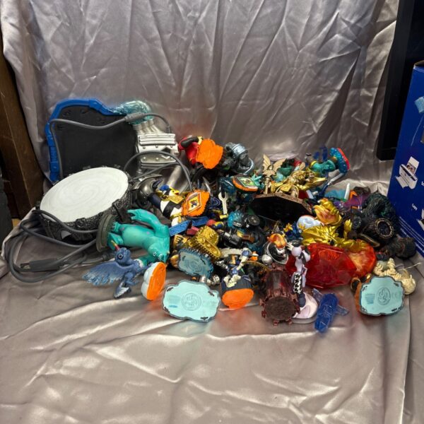 Collection of colourful Skylander figures and a portal.