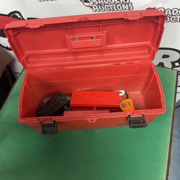 Vintage Snap On toolbox with ratchets inside, ideal for tool storage.