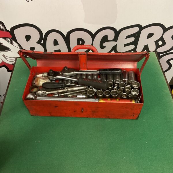 Vintage socket wrench set inside a metal toolbox.