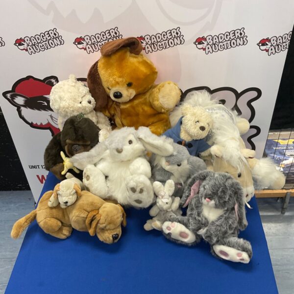 A colourful bundle of vintage soft toys including a bear and a dog.