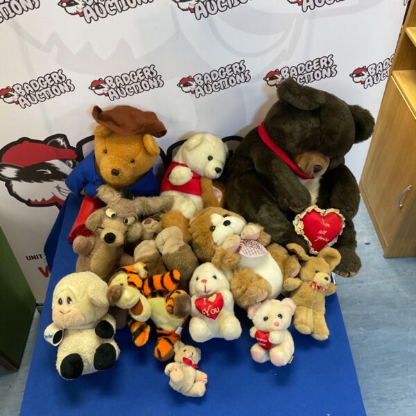 Assorted soft toy bundle featuring Paddington Bear and Wiley Coyote.