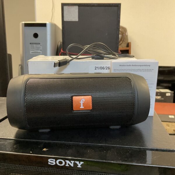 Small Sony Bluetooth speaker presented for auction.