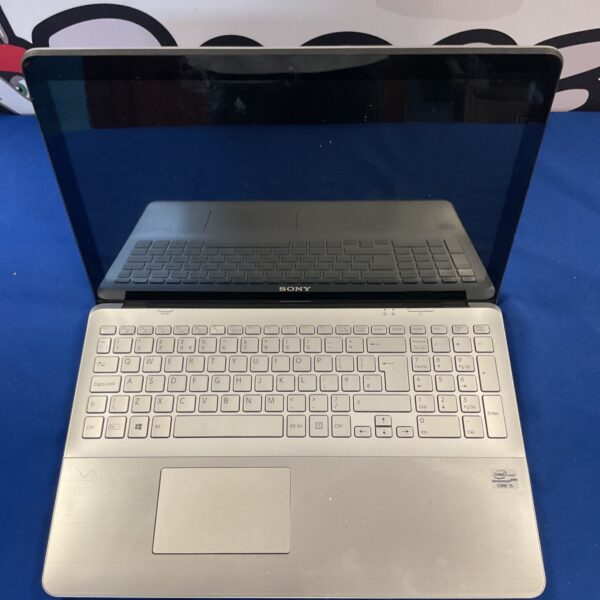 Silver Sony VAIO Fit 15 laptop with keyboard visible.