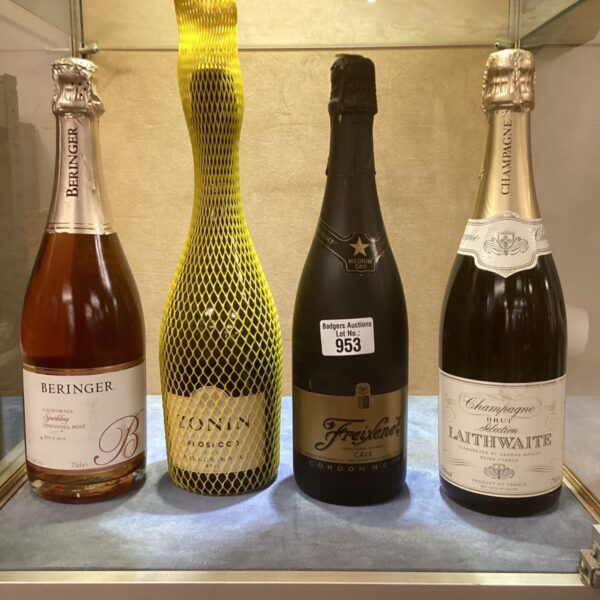 Collection of unopened sparkling wine bottles including Behringer rosé.