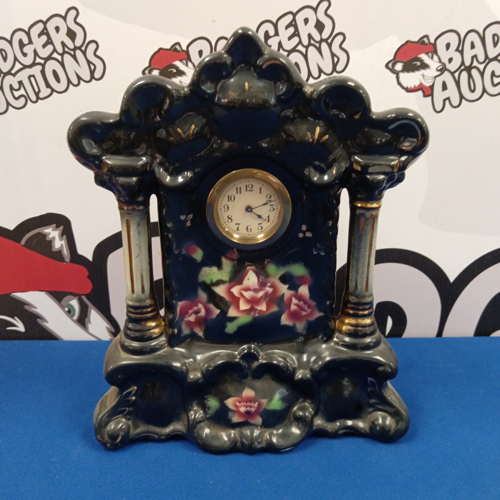 Vintage Staffordshire mantle clock with floral design.