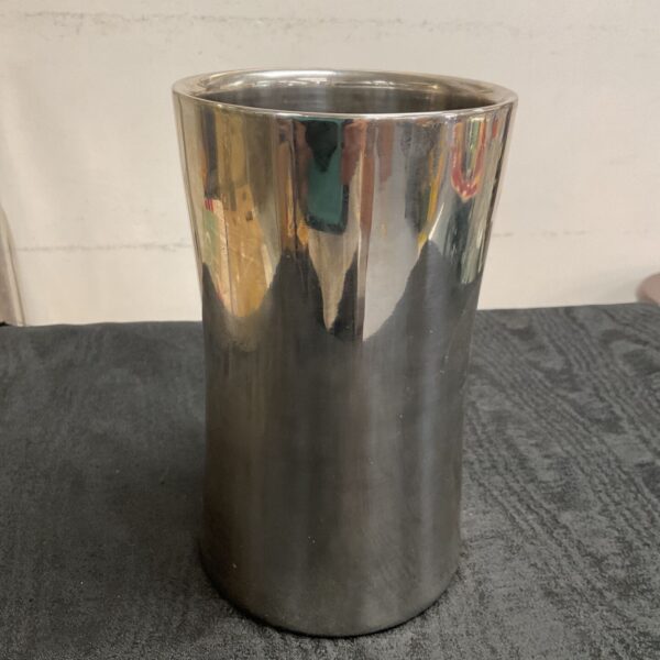 Polished stainless steel wine cooler for chilling bottles.
