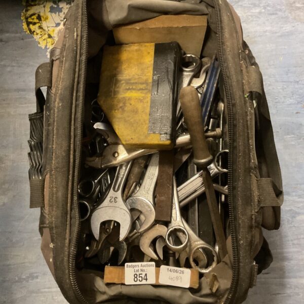 Black Stanley Fat Max tool bag filled with hand tools.