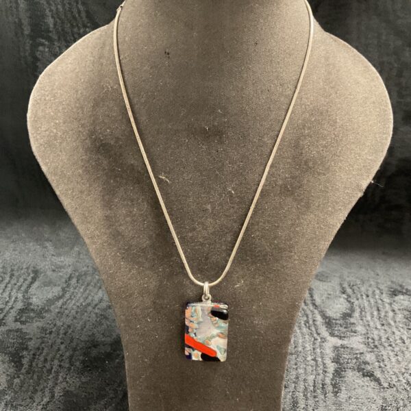 Vibrant Murano glass pendant on a sterling silver necklace.