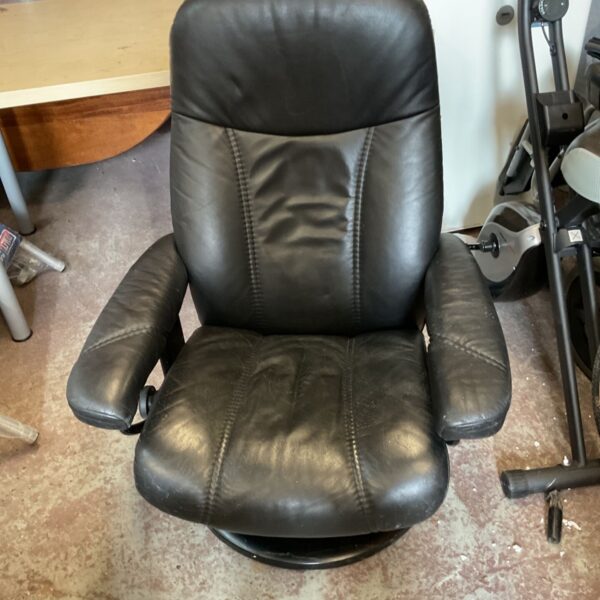 Black leather Stressless Consul recliner chair with swivel base.