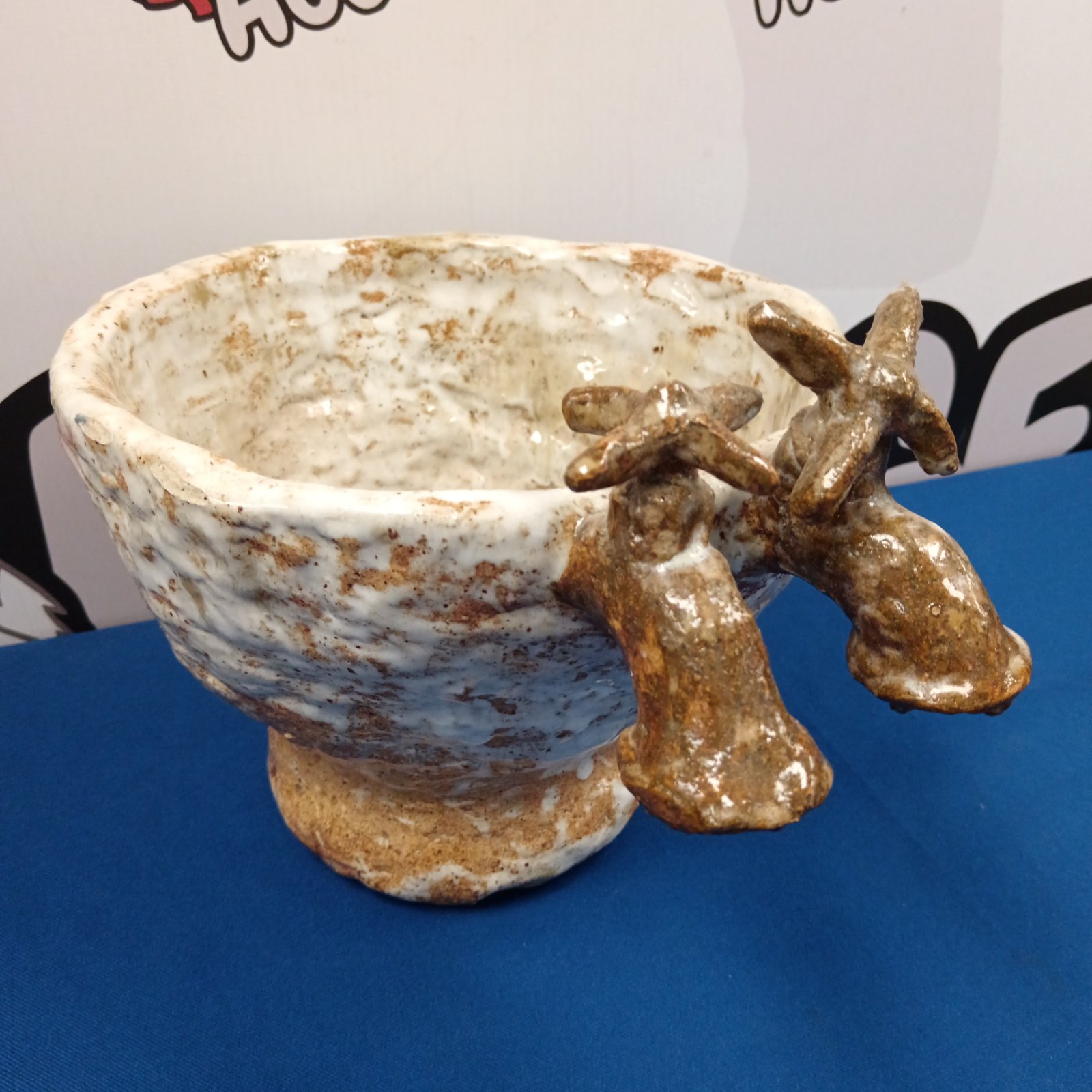 Handmade studio pottery bowl with rabbit sculptures.