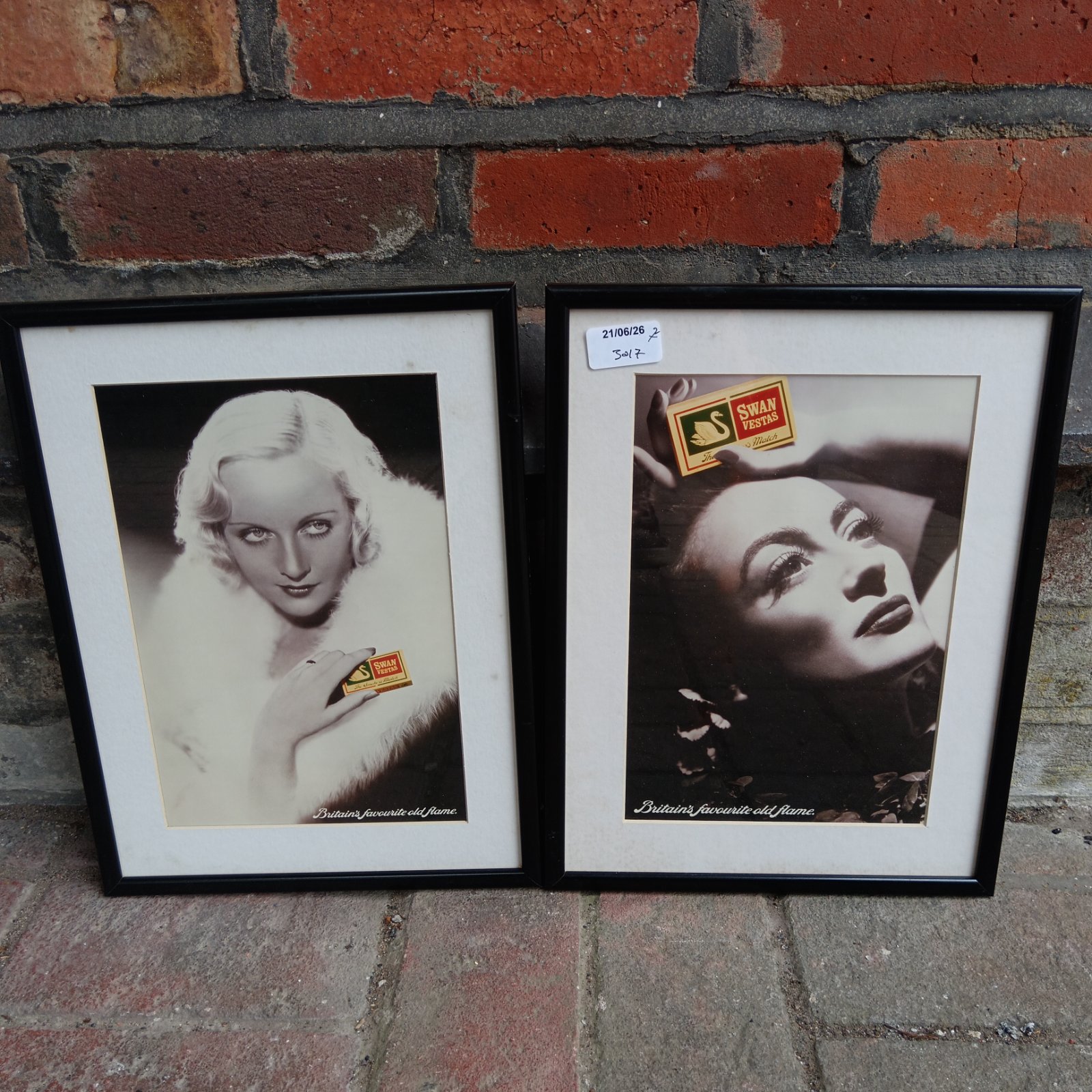 Pair of framed Swan Vestas match advertising prints in art deco style.