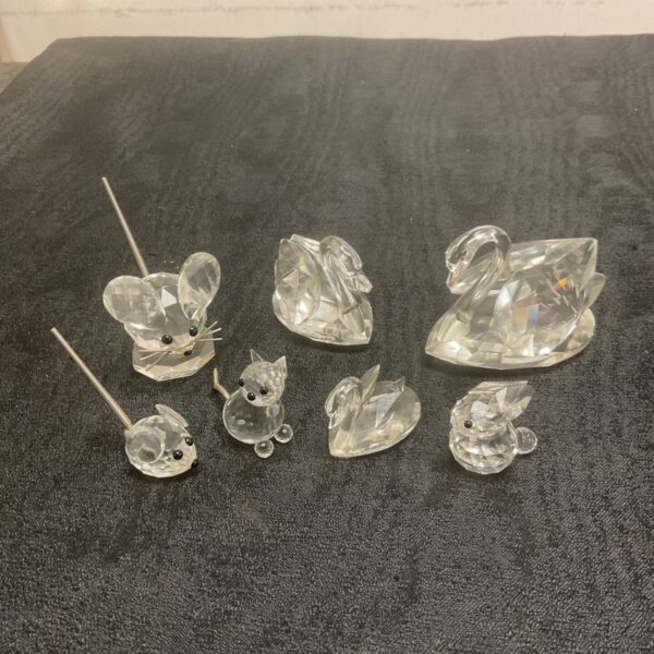 Swarovski crystal animal collection featuring a swan, mouse, rabbit and cat.