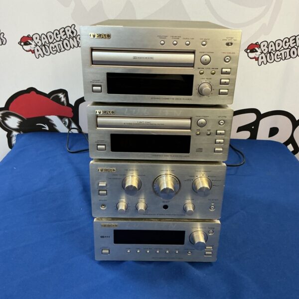 Vintage Teac stereo system components including CD player and cassette deck.