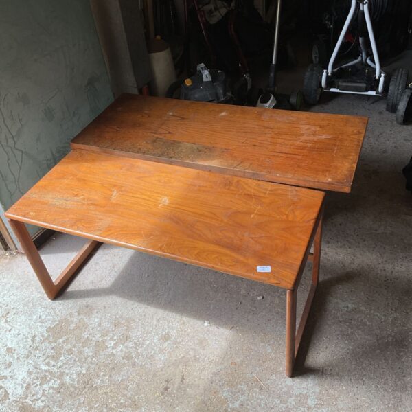 Vintage teak coffee table with angled legs.