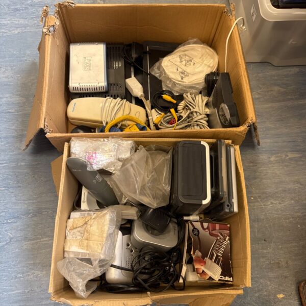 Mixed lot of telecoms equipment including modems and routers.