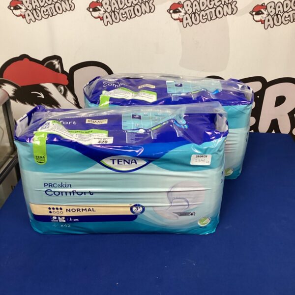 Two packs of unopened Tena Comfort Pads for incontinence.
