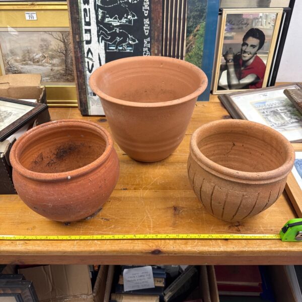 Lot of three vintage terracotta plant pots for garden use.